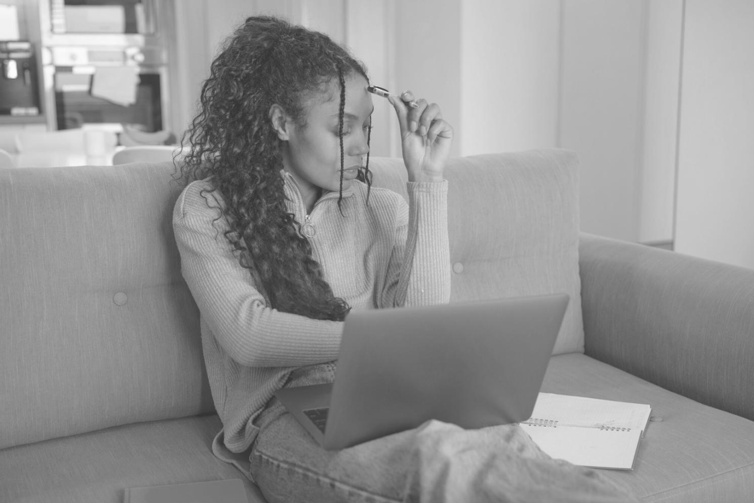 Group of students collaborating on software testing project using computers and discussing findings